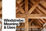 Windstrebe diagonal timber braces supporting a traditional wooden roof structure.